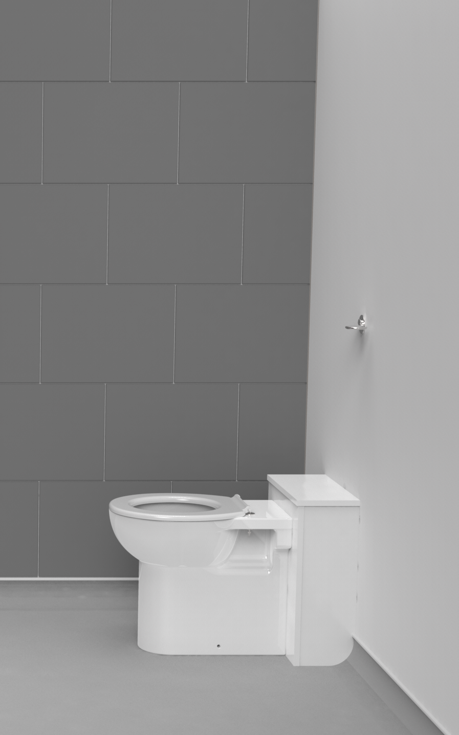 White back to wall toilet against a gray tiled wall