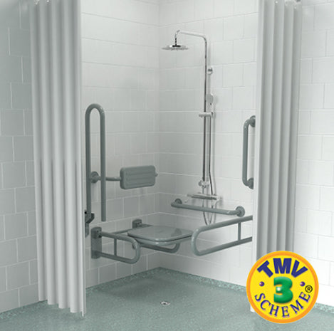 Shower setup with grab bars and a seat in a tiled shower area, featuring the TMV Scheme logo.